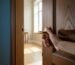A hand opening a door to a bright room, symbolizing the decision to start couples therapy.